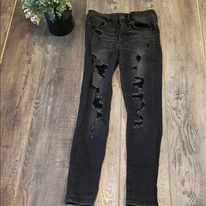 Ripped/faded black skinny jeans